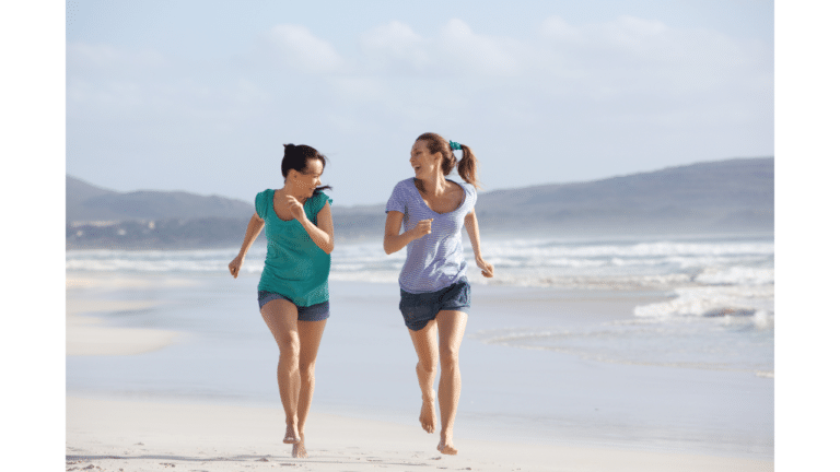 Active friends running on a beach