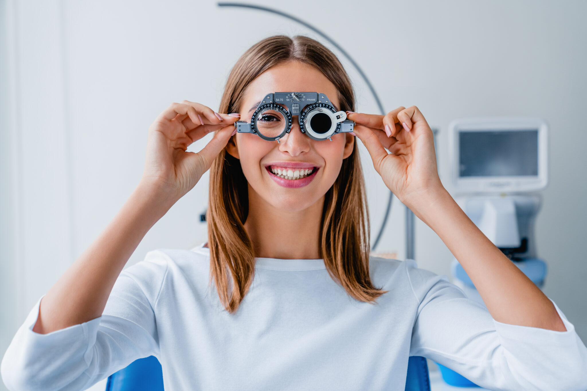 Woman checking her vision with eye test glasses